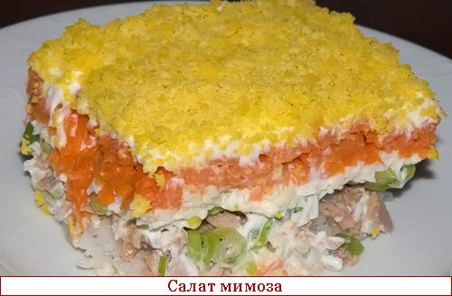 Рыбный салат с рисом, яйцом и зеленым горошком